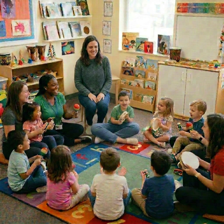 Children and teachers sitting in a circle playing musical instruments and singing
